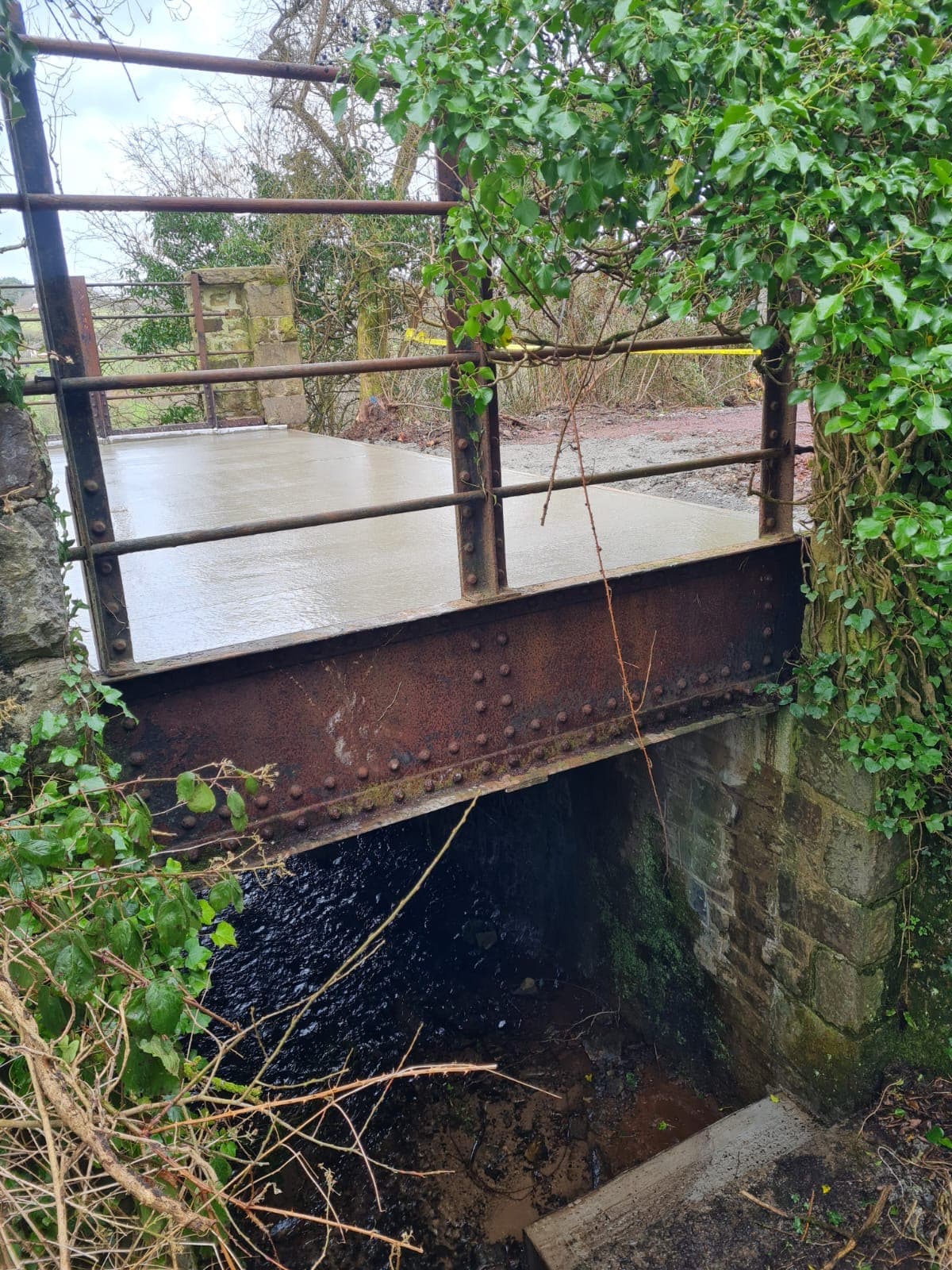 Concrete bridge pad construction