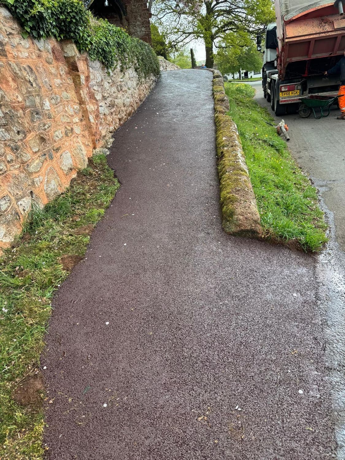 Kenn Church footpath after red tarmac resurfacing to the kissing gate, Devon