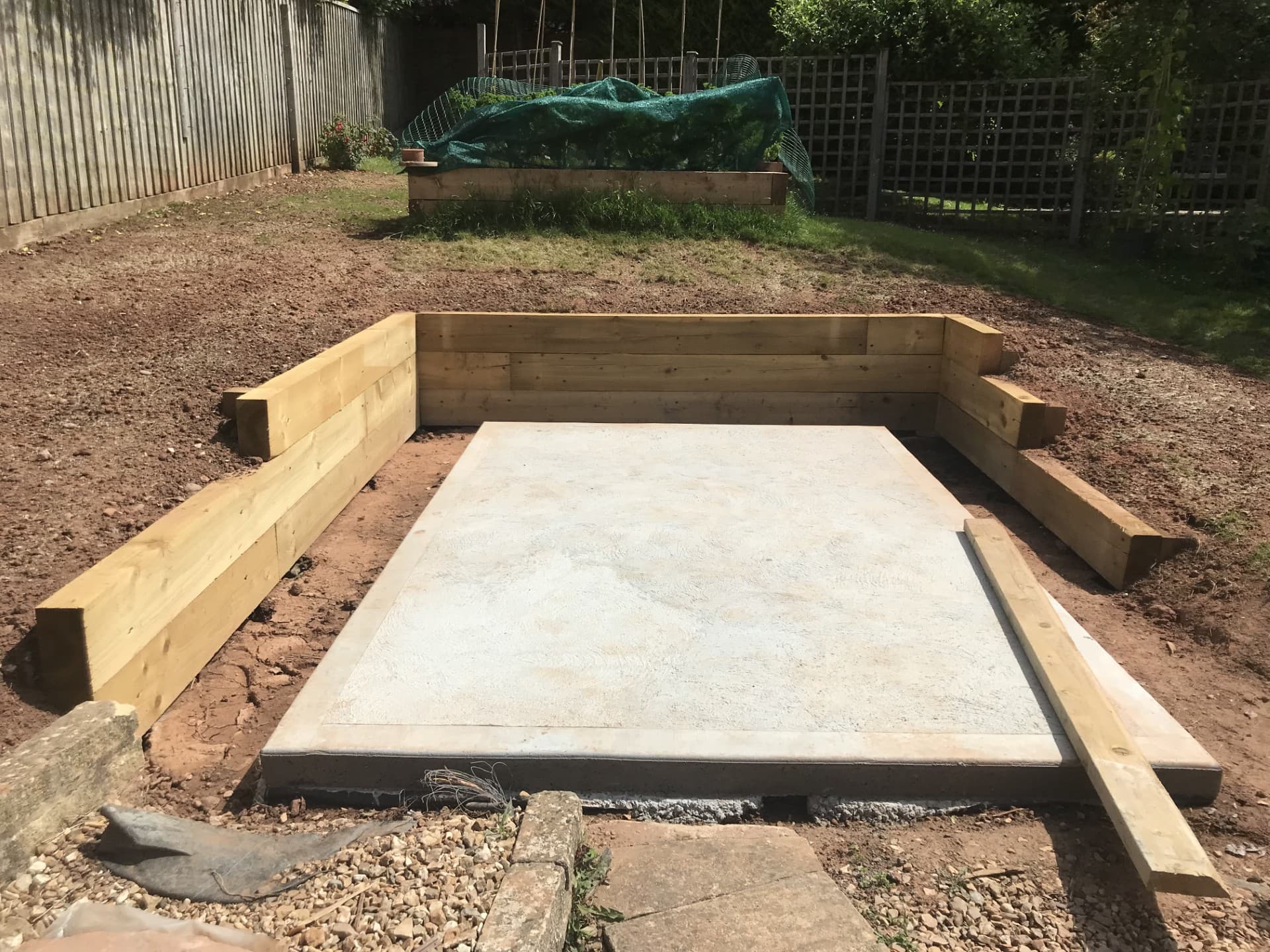 Greenhouse concrete pad foundation